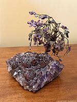 Front view of wire gemstone tree on amethyst cluster base