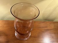 Oblique top view showing flared rim and rose tint