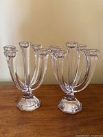 Pair of Nachtmann crystal five-arm candelabra on wooden surface