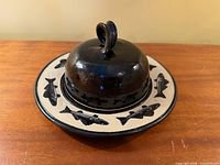 Butter dish assembled showing fish motif and domed lid
