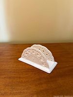 Front angled view showing raised floral lace design