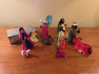 Front view of all tin nativity figures and storage box
