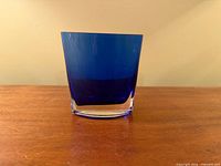 Front view showing cobalt blue body and clear base