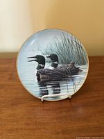 Front view showing loon artwork and gold rim