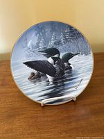 Front view showing loon artwork and gold rim