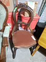 Full view of carved wood balloon back chair