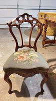 Front view of Victorian walnut parlor chair