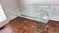 Full view of glass coffee table on wood floor