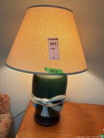 Front view of lamp showing shade and ceramic base