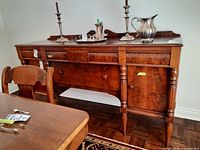 Front view of Malcolm wood sideboard with doors and drawer