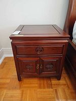 front view of wood nightstand closed