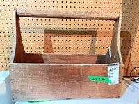 front view of wooden toolbox showing label and dimensions