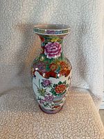 Full view of vase front showing floral motifs and cartouche