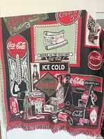 Full view of Coca-Cola advertising cotton throw blanket showing overall design and fringe