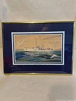 Full view of framed print showing ship scene, mat and frame