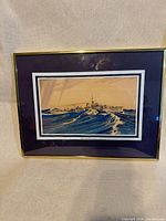 Front view of framed print showing ship scene, matte, frame