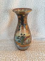 Front view showing figures scene and gold detailing