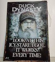 Front view of entire Duck Dynasty metal sign with text and image