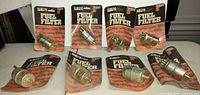Eight Fleetguard FF-242 fuel filters on cards