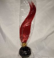 Wig in sealed plastic bag front view