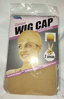 Front of sealed Dream Deluxe wig cap package showing branding and 2 pieces