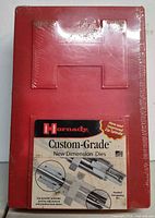 Front view of sealed Hornady Custom-Grade New Dimension Dies red case showing label
