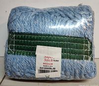 Front view of packaged Super Stitch Blend medium mop head showing label