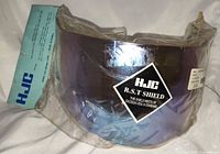 Sealed HJC R.S.T face shield with hang tag visible