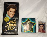 Front view of all three Elvis Presley items: RCA box set, vinyl sleeve, cassette
