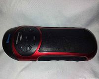 Side view of Schwinn Bluetooth flashlight showing control panel and speaker grille