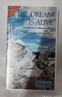 Front of VHS sleeve showing title, imagery, IMAX Space Library branding
