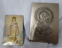 Infant Jesus print and metal Sacred Heart plaque side by side