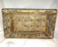 Interior view showing starburst embossing and patina