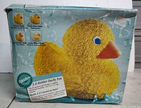 Front of boxed Wilton 3-D Rubber Ducky Pan