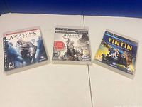 Front view of three PS3 game cases