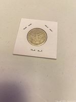 reverse of 1899 Barber quarter in 2x2 flip