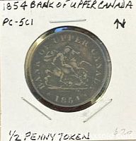Obverse of 1854 Bank of Upper Canada half penny token in holder