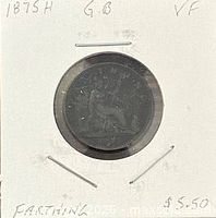 Front of 2x2 holder with coin, date and notes visible