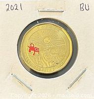 Reverse of coin, coloured Klondike design, in holder