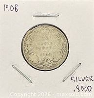 Coin reverse in 2x2 holder showing wreath design and denomination