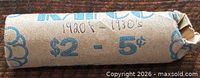 Front view of paper-wrapped roll showing handwritten “1920’s – 1930’s $2 – 5¢”