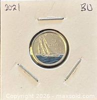 Coin in 2×2 holder, date and BU noted