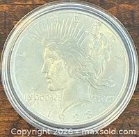 Obverse of 1923 Peace Dollar in holder