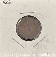 Reverse side of 1928 Canadian one-cent coin in holder