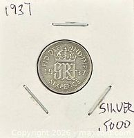 Coin in 2x2 holder with handwritten notes