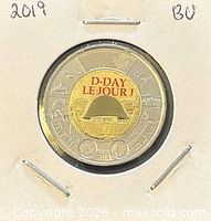 Reverse of 2019 colour D-Day toonie in holder showing helmet design