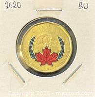 Reverse of 2020 colourized loonie in holder