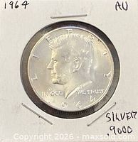 Coin obverse in holder showing date 1964 and AU notation