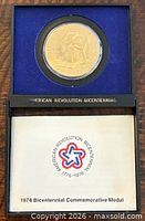 Medal in blue presentation case with booklet