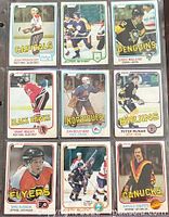 Front view of nine 1981-82 O-Pee-Chee NHL hockey cards in plastic sleeve